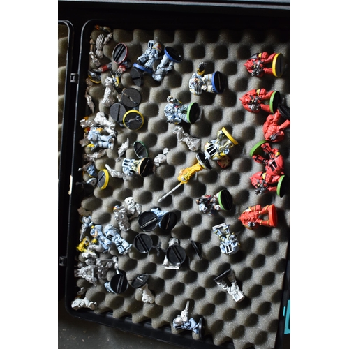 434 - A pair of plastic carry cases containing a quantity of Warhammer figures (mainly plastic).