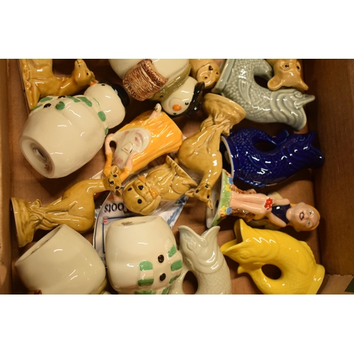 50 - A collection of Wade items to include gargle fish jugs, Collectania, snowmen cruets, Christmas 1998 ... 