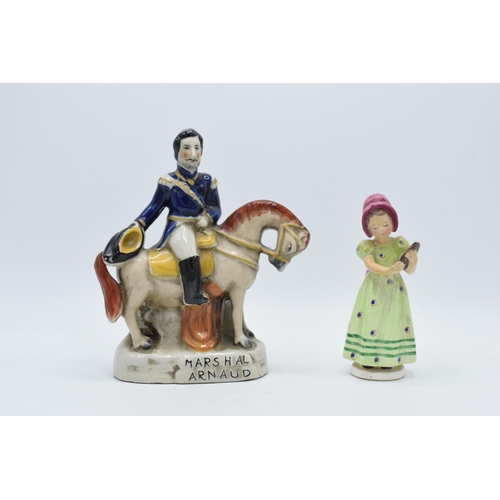 60 - An early Goebel / Hummel figurine of a girl holding a portrait FB1 together with a Staffordshire fla... 