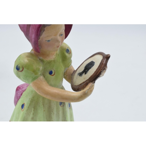 60 - An early Goebel / Hummel figurine of a girl holding a portrait FB1 together with a Staffordshire fla... 