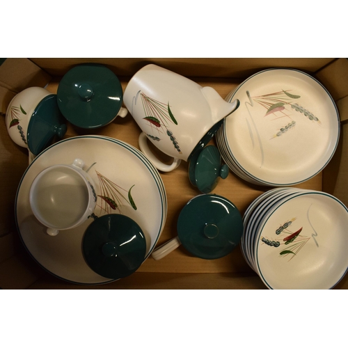 61 - A large collection of Denby Stoneware Greenwheat tea and dinner ware to include bowls, plates, tea p... 