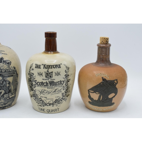 61A - A trio of stoneware whisky flagons to include Auld Lang Syne H Kennedy Glasgow, The Kintore Scotch W... 