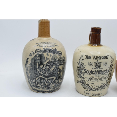 61A - A trio of stoneware whisky flagons to include Auld Lang Syne H Kennedy Glasgow, The Kintore Scotch W... 