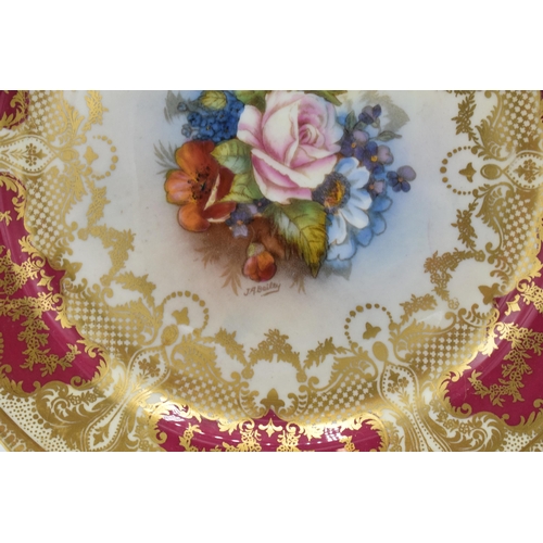 62 - Aynsley floral and gilt 21cm cabinet plate with floral decoration signed 'J A Bailey'.