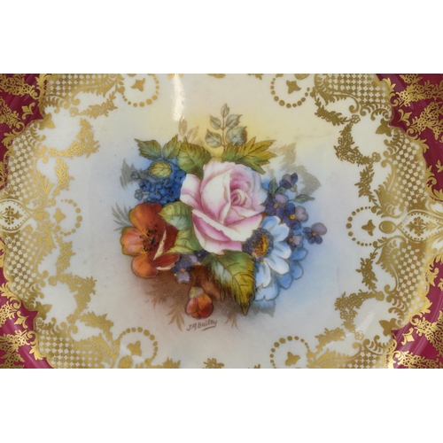 62 - Aynsley floral and gilt 21cm cabinet plate with floral decoration signed 'J A Bailey'.