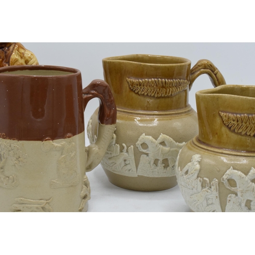 66 - A collection of late 19th century two-tone stoneware jugs with traditional scenes together with '183... 