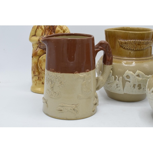 66 - A collection of late 19th century two-tone stoneware jugs with traditional scenes together with '183... 