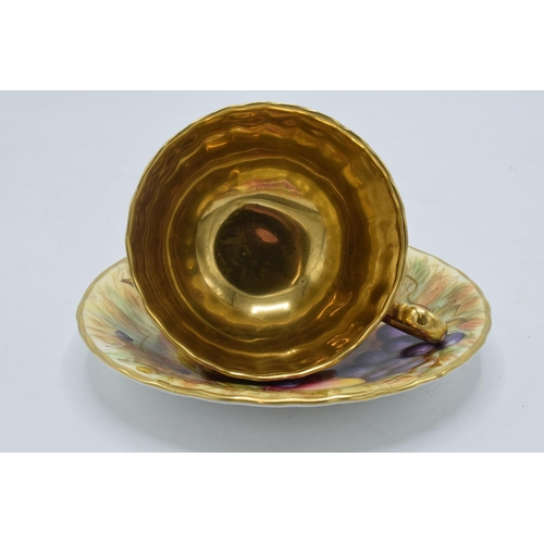 72 - Aynsley Orchard Gold cup and saucer with gold detailing and interior, signed N Brunt, cup af (2).