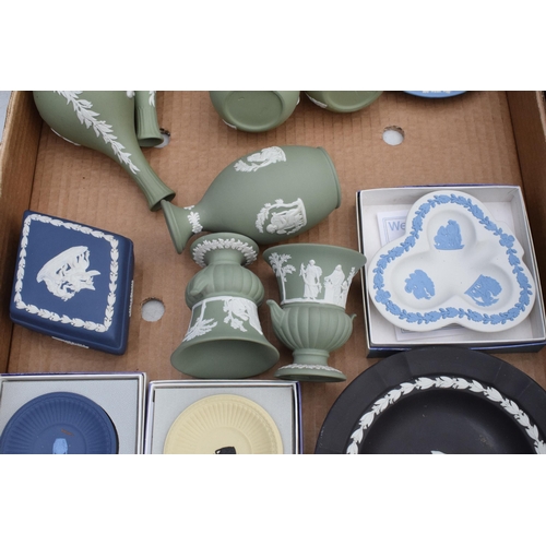 76 - A collection of Wedgwood Jasperware in varying colours to include yellow, black and green to consist... 