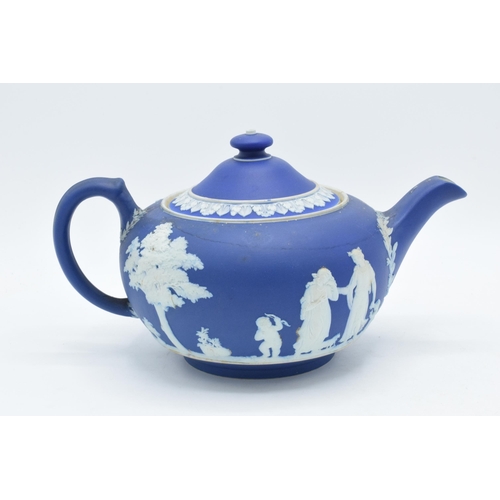 78 - Wedgwood dark blue Jasperware teapot together with a tall jug with unusual handle (2).