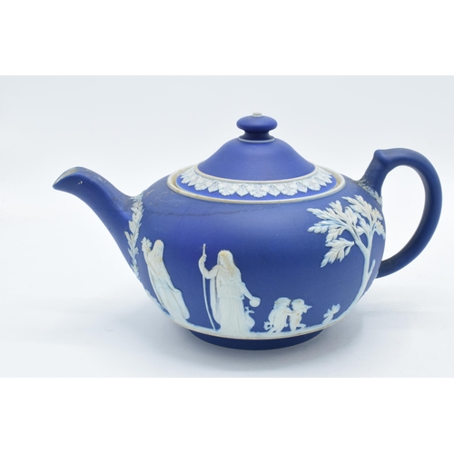 78 - Wedgwood dark blue Jasperware teapot together with a tall jug with unusual handle (2).