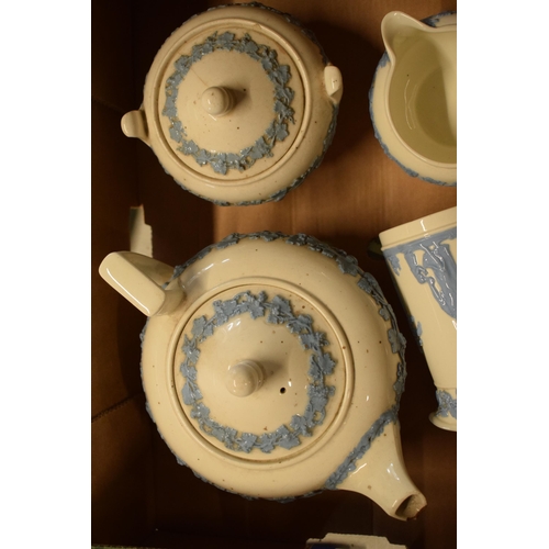 88A - Wedgwood blue and white Queensware items to include a teapot, lidded sugar, milk jug and creamer (4)... 