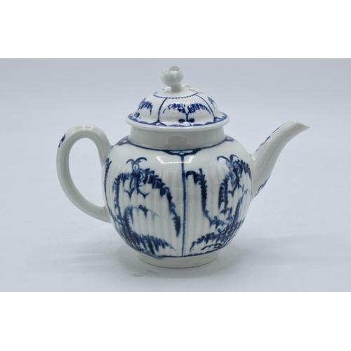 101 - A late 18th / early 19th century blue and white pottery teapot with crescent mark to base, 12.5cm ta... 