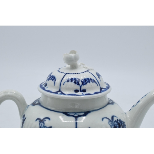 101 - A late 18th / early 19th century blue and white pottery teapot with crescent mark to base, 12.5cm ta... 