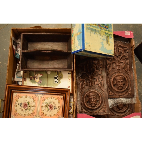 12 - A mixed collection of items to include plaster wood-effect panels of varying forms, vintage tin, pla... 