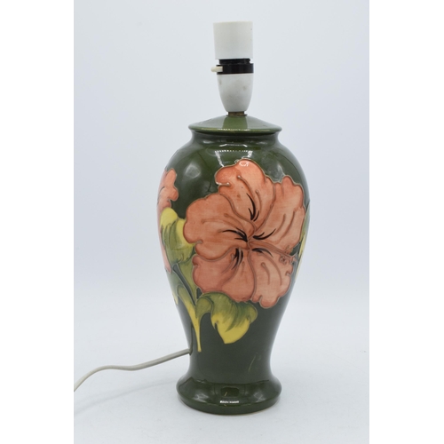 168 - Moorcroft pottery lamp base with hibiscus on green, 34cm inc fittings.