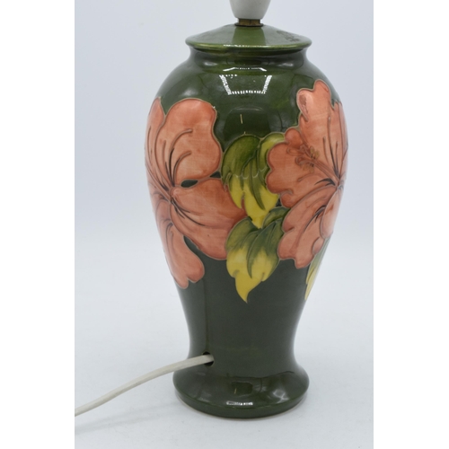 168 - Moorcroft pottery lamp base with hibiscus on green, 34cm inc fittings.