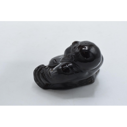 194 - Chinese obsidian buddha figure, 7cm wide.