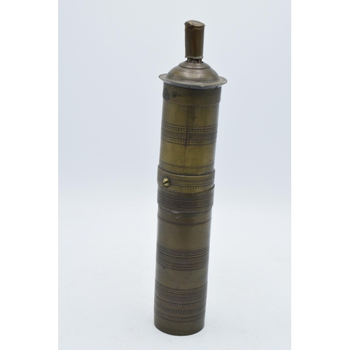 196 - 19th century brass Arabic cylindrical spice grinder, 29cm long.