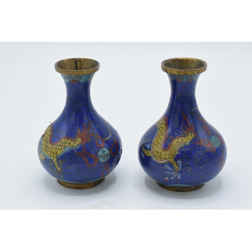 198 - A pair of Japanese Cloisonné vases with dragon decoration on a dark blue background, 1 with damage, ... 