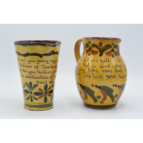 2 - A pair of Devon Motto ware jugs in similar traditional colours to include 'come fill me with liquors... 