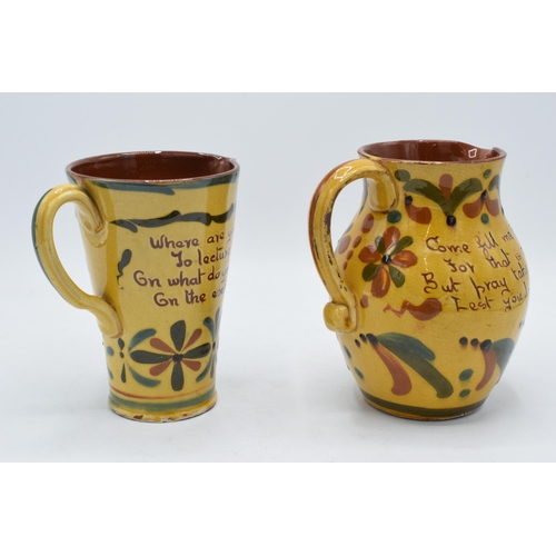 2 - A pair of Devon Motto ware jugs in similar traditional colours to include 'come fill me with liquors... 