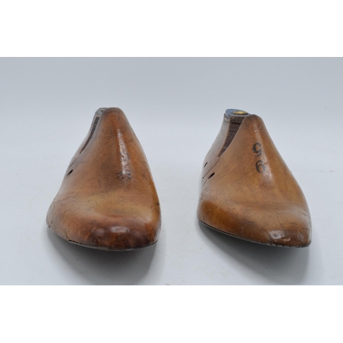 229 - A pair of vintage wooden and metal cobblers shoe moulds (2). 30cm long.