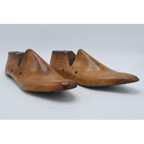 229 - A pair of vintage wooden and metal cobblers shoe moulds (2). 30cm long.