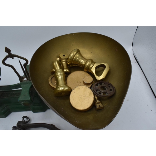 230 - A set of painted green postage scales together with small brass weights and a food grinder (Qty).