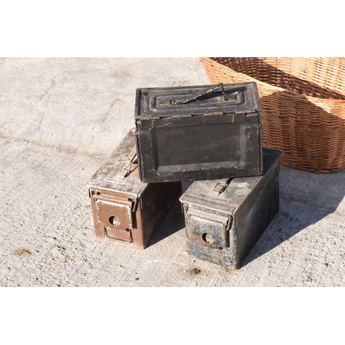 232 - A trio of vintage metal ammunition boxes together with a vintage wicker basket, 63cm at widest (4).