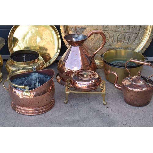 234 - A collection of quality brass and copper items to include brass coal scuttles, large Eastern charger... 