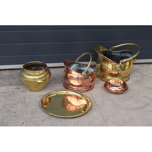 234 - A collection of quality brass and copper items to include brass coal scuttles, large Eastern charger... 