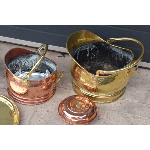 234 - A collection of quality brass and copper items to include brass coal scuttles, large Eastern charger... 