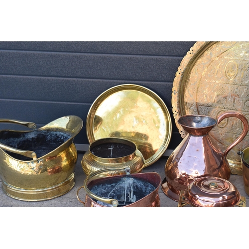 234 - A collection of quality brass and copper items to include brass coal scuttles, large Eastern charger... 