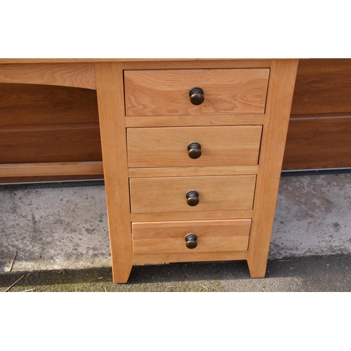 239 - Heavy oak kneehole desk flanked by a set of drawers, 107 x 46 x 76cm tall.