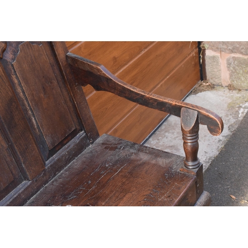 240 - 18th century oak settle with panelled back support, 107 x 46 x 76cm tall.