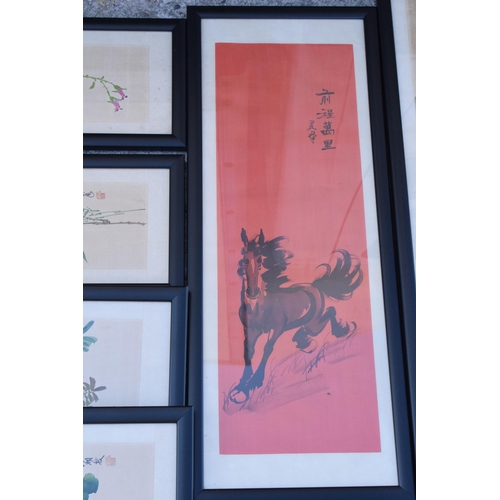 246 - A collection of 20th century oriental paintings on silk in black frames of varying scenes and sizes,... 