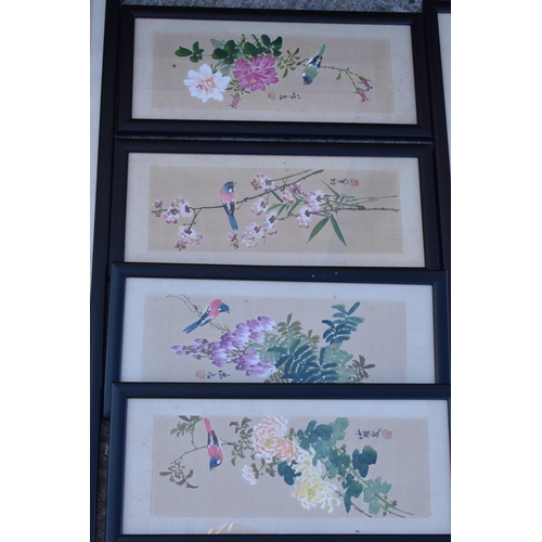 246 - A collection of 20th century oriental paintings on silk in black frames of varying scenes and sizes,... 