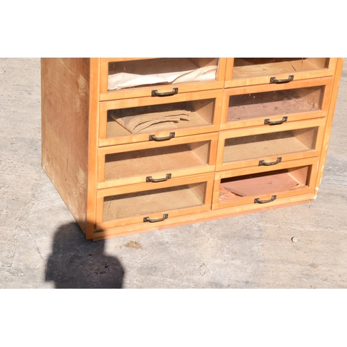 247 - 20th century wooden and glass haberdashery chemists shop bank of drawers with glass fronts, 90 x 56 ... 