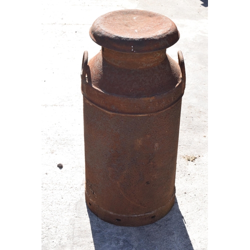 248 - A vintage early to mid 20th century milk churn. 72.5cm tall.