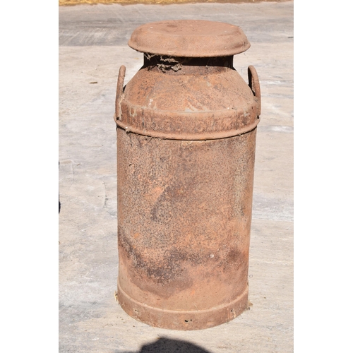 251 - A vintage early to mid 20th century milk churn. 72.5cm tall.