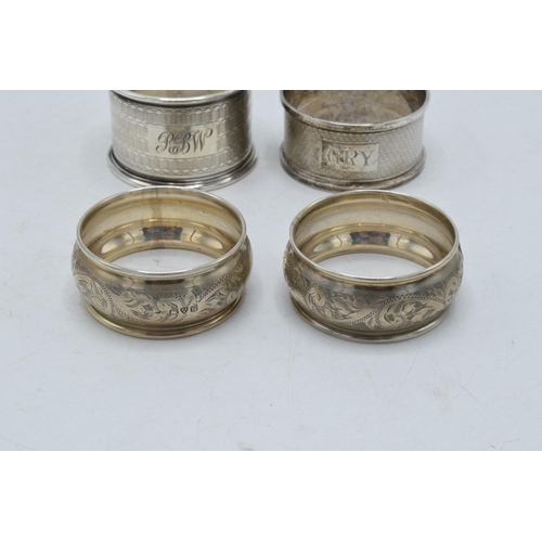 274 - 4 hallmarked silver napkin rings to include a pair, Chester 1923, one Birm 1924 and Birm 1921 (4). 4... 