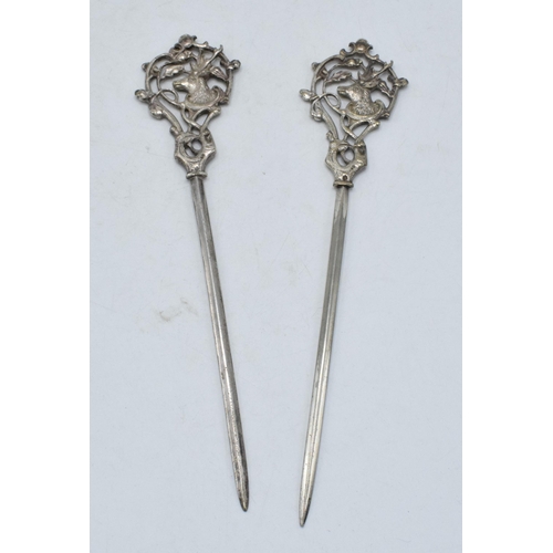 295 - A pair of silver plated meat skewers with stag's heads amongst foliage, 22.5cm long (2).