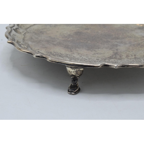 300 - Silver salver, circular form with shaped edges standing proud on 4 feet. 235.5 grams / 7.57 oz. Ches... 