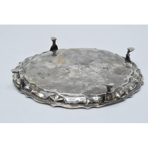 300 - Silver salver, circular form with shaped edges standing proud on 4 feet. 235.5 grams / 7.57 oz. Ches... 