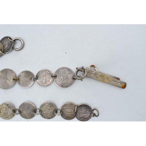 327 - Silver plated love token chatelaine with silver coins, 22cm long.