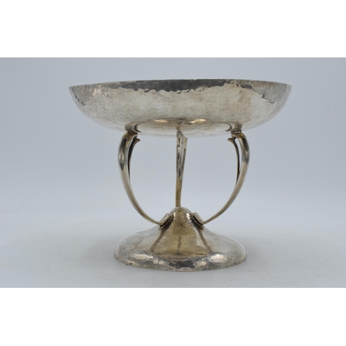 328 - Silver Mappin & Webb Arts and Crafts pedestal bowl with hand hammered decoration on three legs, 20cm... 