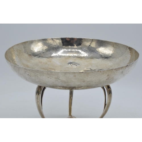 328 - Silver Mappin & Webb Arts and Crafts pedestal bowl with hand hammered decoration on three legs, 20cm... 