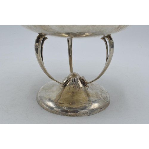 328 - Silver Mappin & Webb Arts and Crafts pedestal bowl with hand hammered decoration on three legs, 20cm... 