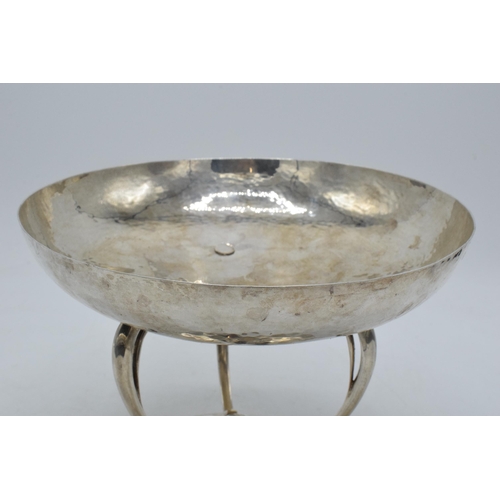 328 - Silver Mappin & Webb Arts and Crafts pedestal bowl with hand hammered decoration on three legs, 20cm... 